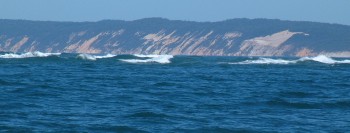 Breaking swells to the side of Wide Bay entrance