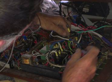 Jon rewiring the spaghetti behind our circuit breaker panel