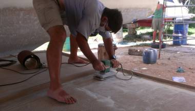 Sanding the top of the bimini - hard work